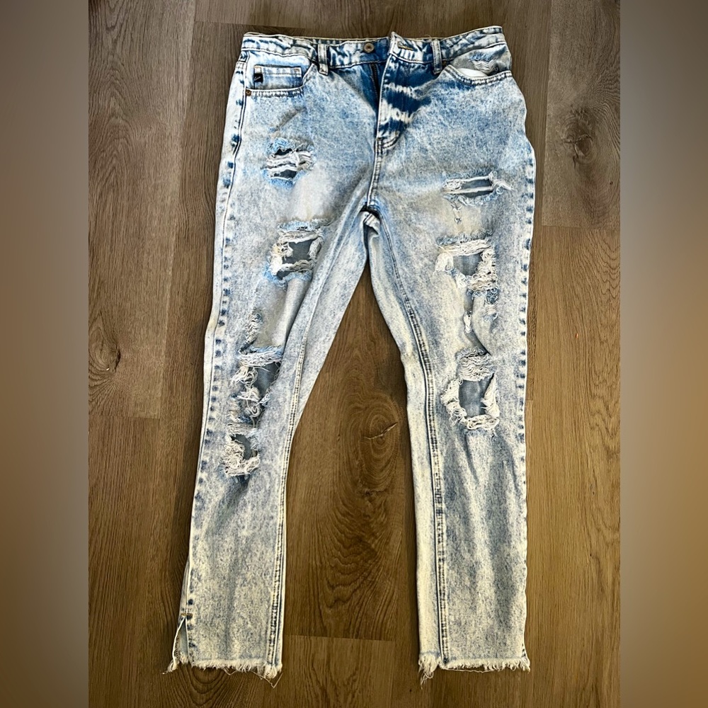Distressed Kancan Jean. Never been worn. Size 7.